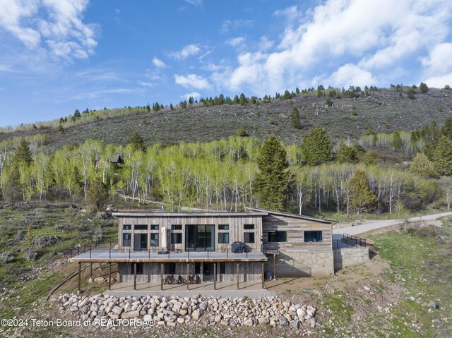 5170 Meandering Moose Dr, Victor, ID 83455 - rear view of property with a deck