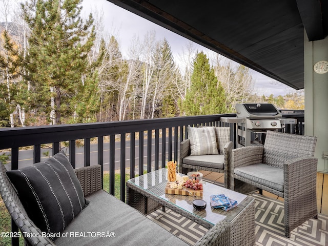 7280 N Rachel Way Unit B-7, Teton Village, WY 83025 - wooden terrace featuring grilling area and an outdoor hangout area