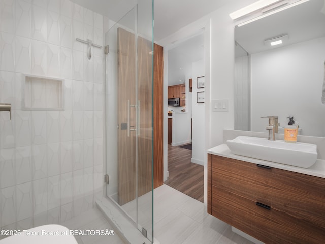 7280 N Rachel Way Unit B-7, Teton Village, WY 83025 - bathroom with vanity, a shower stall, and toilet
