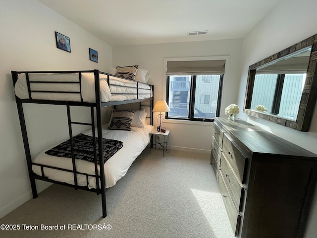 7280 N Rachel Way Unit B-7, Teton Village, WY 83025 - bedroom with baseboards and light carpet