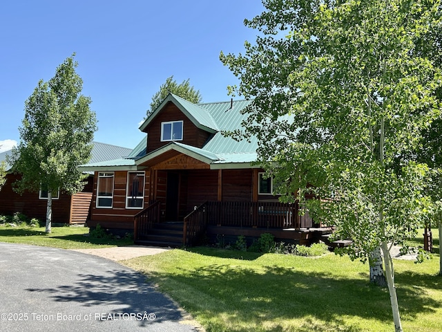 1890 Leigh Creek Ests, Tetonia, ID 83452 - log cabin with a porch, a front yard, and metal roof
