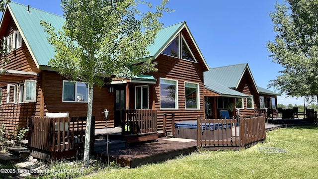 1890 Leigh Creek Ests, Tetonia, ID 83452 - back of property with a hot tub, metal roof, a wooden deck, and a yard