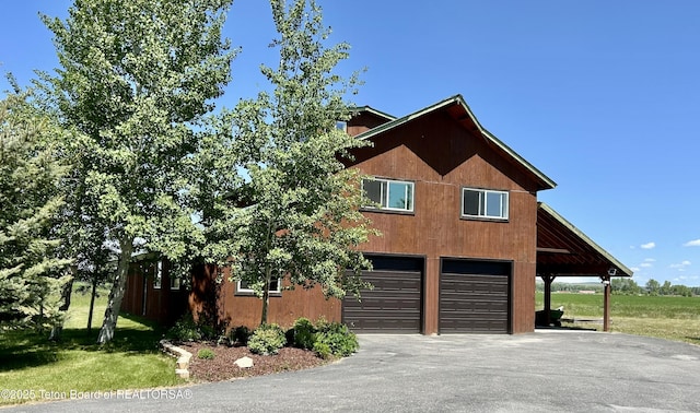 1890 Leigh Creek Ests, Tetonia, ID 83452 - view of front of property with driveway, a garage, and a front lawn