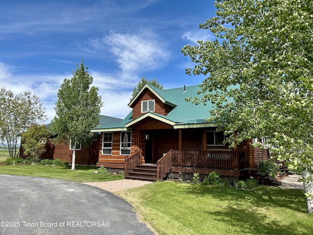 1890 Leigh Creek Ests, Tetonia, ID 83452 - view of front of home featuring covered porch, a front lawn, and a metal roof