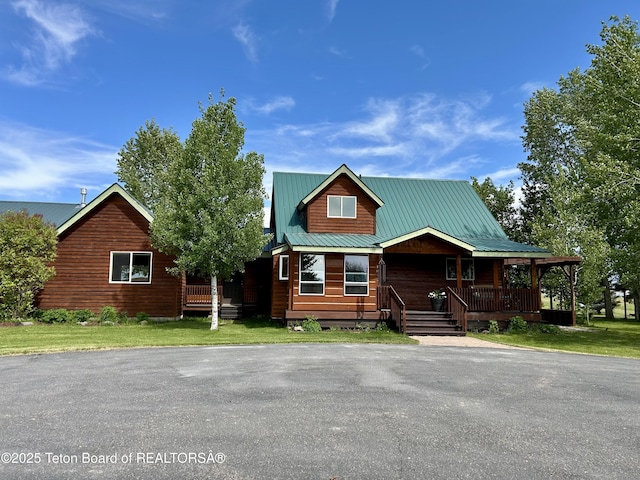 1890 Leigh Creek Ests, Tetonia, ID 83452 - view of front of house featuring a porch and a metal roof