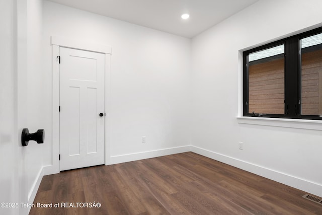 833 Booshway St, Driggs, ID 83422 - empty room with baseboards, dark wood-style floors, and recessed lighting