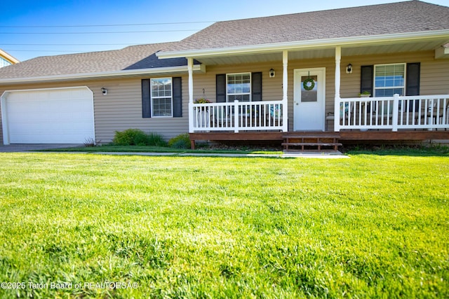 28 Brushwood Dr, Star Valley Ranch, WY 83127 - view of front facade featuring covered porch, an attached garage, a front lawn, and a shingled roof