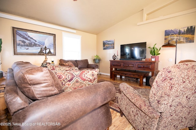 28 Brushwood Dr, Star Valley Ranch, WY 83127 - living area with lofted ceiling, light wood-type flooring, and baseboards