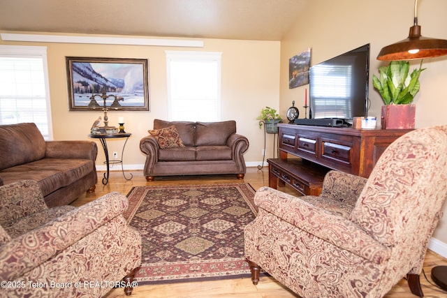28 Brushwood Dr, Star Valley Ranch, WY 83127 - living room with baseboards, lofted ceiling, and wood finished floors