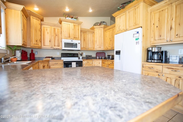 28 Brushwood Dr, Star Valley Ranch, WY 83127 - kitchen featuring white appliances, a sink, light brown cabinetry, and recessed lighting
