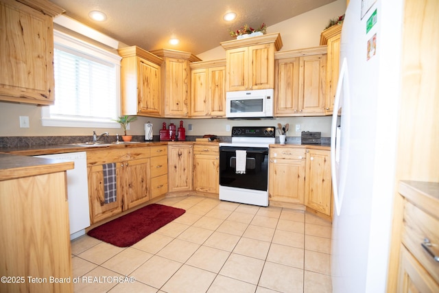 28 Brushwood Dr, Star Valley Ranch, WY 83127 - kitchen with white appliances, light brown cabinetry, a sink, light tile patterned floors, and recessed lighting