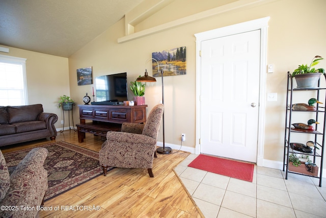 28 Brushwood Dr, Star Valley Ranch, WY 83127 - living room with lofted ceiling, light wood finished floors, and baseboards