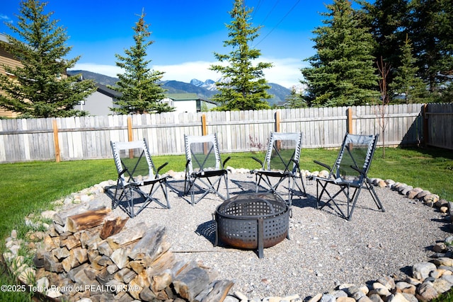 28 Brushwood Dr, Star Valley Ranch, WY 83127 - view of patio featuring an outdoor fire pit and a mountain view