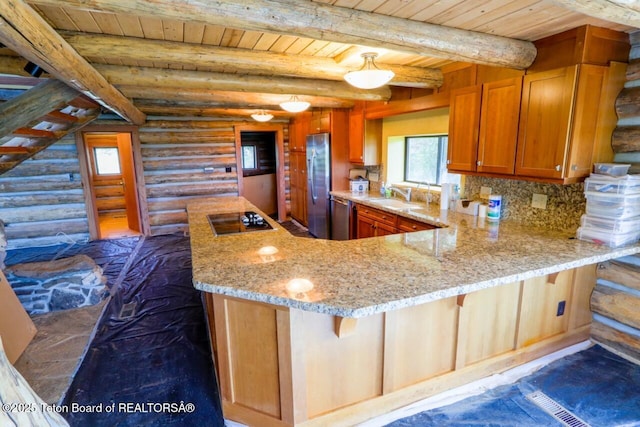 3392 Bainbridge Dr, Tetonia, ID 83452 - kitchen with stainless steel appliances, a wood ceiling with exposed beams, log walls, light stone countertops, and brown cabinetry