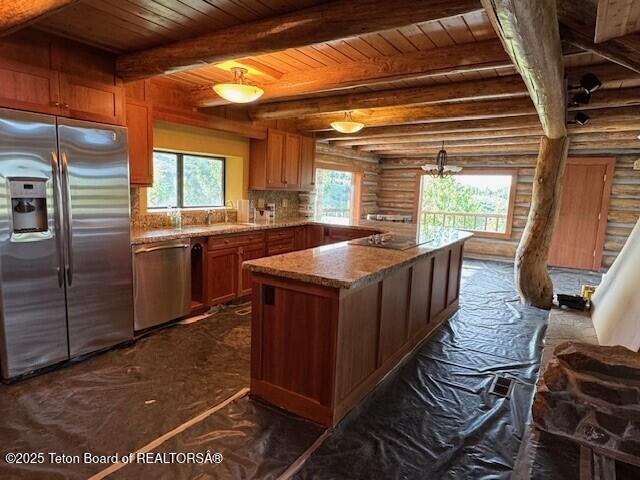 3392 Bainbridge Dr, Tetonia, ID 83452 - kitchen featuring stainless steel appliances, a wooden ceiling with exposed beams, rustic walls, light stone counters, and a peninsula