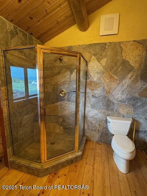 3392 Bainbridge Dr, Tetonia, ID 83452 - bathroom featuring wood ceiling, hardwood / wood-style flooring, and a stall shower