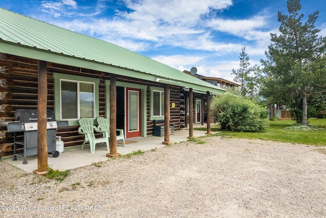 485 E Little Ave, Driggs, ID 83422 - back of house with log exterior and metal roof