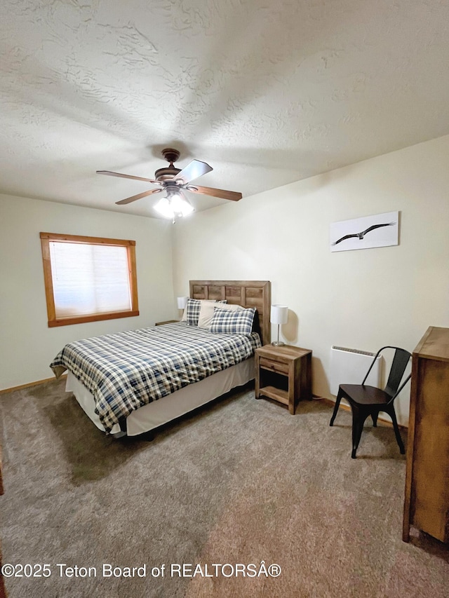 485 E Little Ave, Driggs, ID 83422 - bedroom with light carpet, a textured ceiling, baseboards, and a ceiling fan