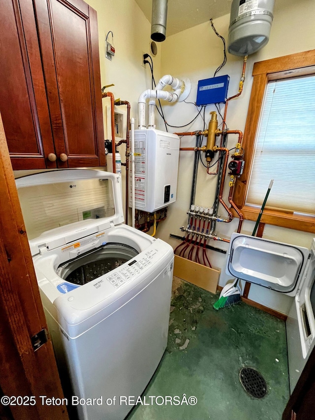 485 E Little Ave, Driggs, ID 83422 - laundry area featuring cabinet space, washer / clothes dryer, and tankless water heater