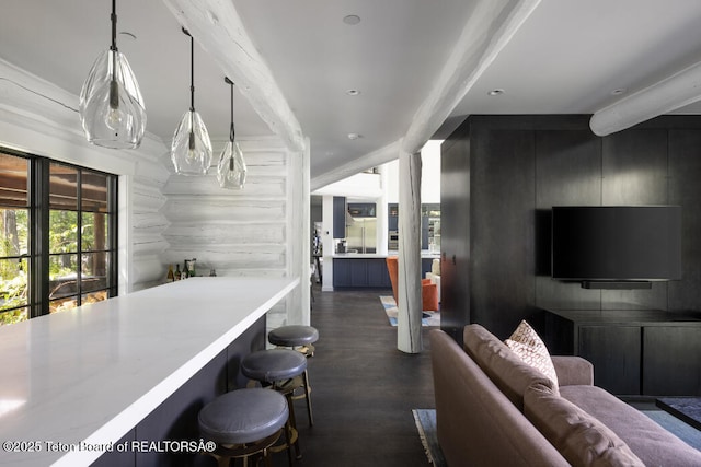 185 S Swan Rd, Jackson, WY 83001 - bar with dark wood-style flooring, beamed ceiling, and pendant lighting