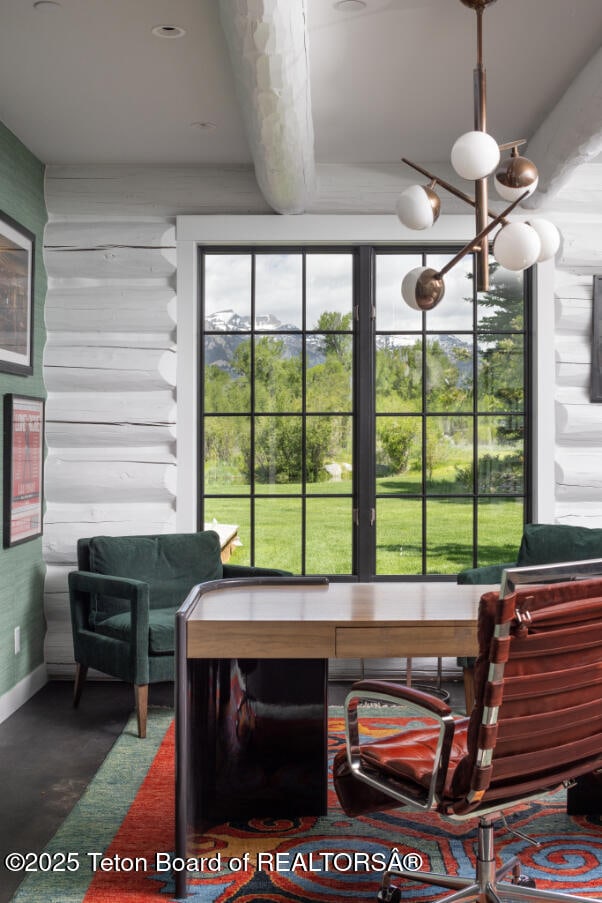 185 S Swan Rd, Jackson, WY 83001 - dining room featuring a chandelier and baseboards