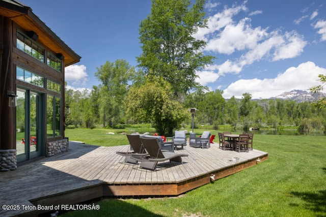 185 S Swan Rd, Jackson, WY 83001 - wooden deck with a lawn, an outdoor hangout area, and outdoor dining space