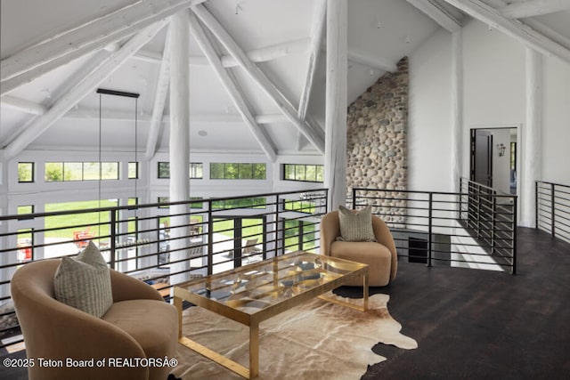 185 S Swan Rd, Jackson, WY 83001 - sitting room with beamed ceiling, high vaulted ceiling, and wood finished floors