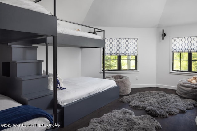 185 S Swan Rd, Jackson, WY 83001 - bedroom featuring lofted ceiling and multiple windows