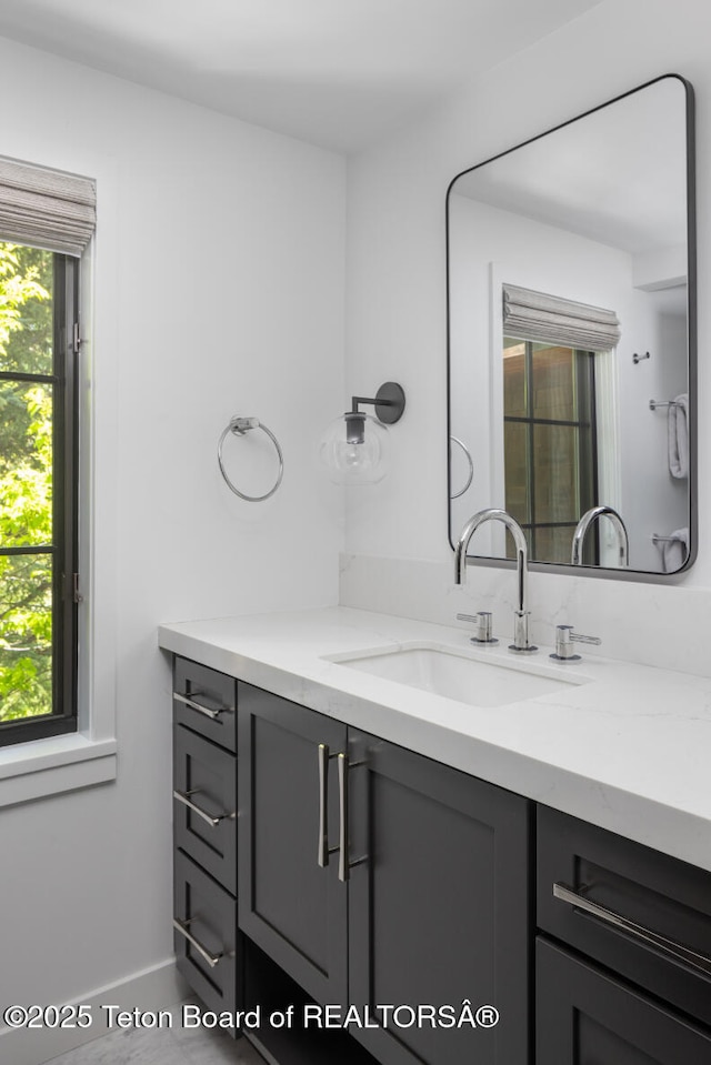 185 S Swan Rd, Jackson, WY 83001 - bathroom with vanity and baseboards