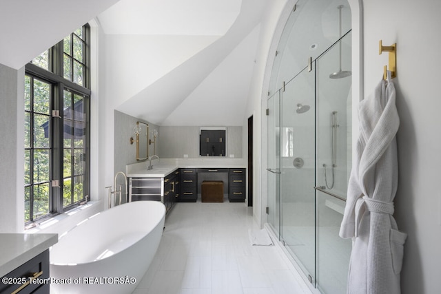 185 S Swan Rd, Jackson, WY 83001 - bathroom with a stall shower, double vanity, a freestanding bath, and high vaulted ceiling