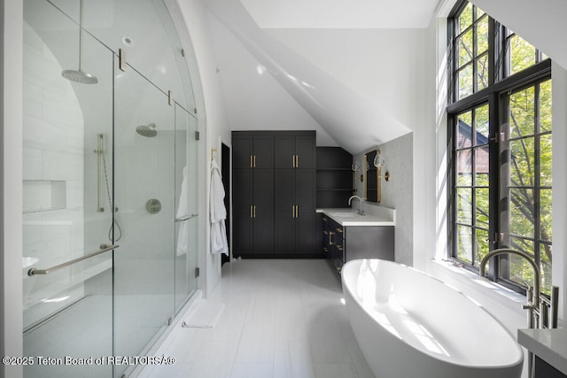 185 S Swan Rd, Jackson, WY 83001 - bathroom featuring a shower stall, vanity, a freestanding bath, and high vaulted ceiling