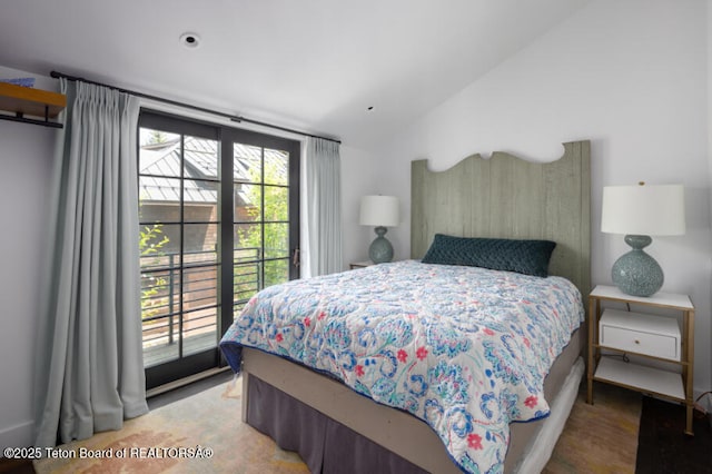 185 S Swan Rd, Jackson, WY 83001 - bedroom with lofted ceiling, multiple windows, and access to outside