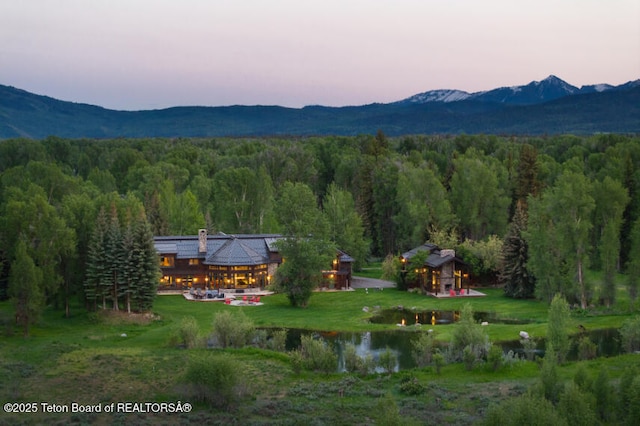 185 S Swan Rd, Jackson, WY 83001 - mountain view featuring a heavily wooded area and a nearby body of water
