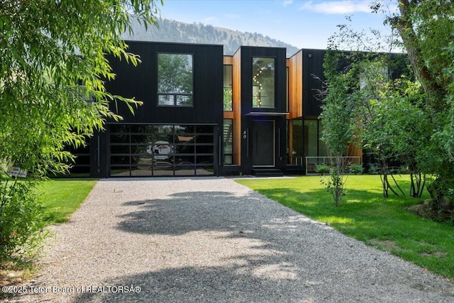 80 Rancher St, Jackson, WY 83001 - contemporary home with a front yard and a mountain view