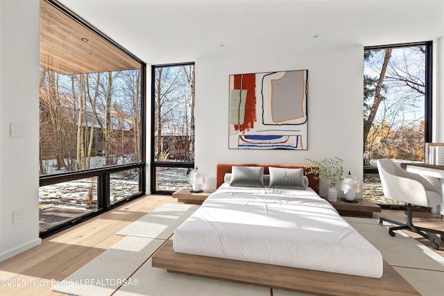80 Rancher St, Jackson, WY 83001 - bedroom featuring expansive windows and wood finished floors