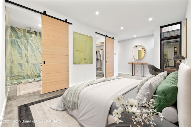 80 Rancher St, Jackson, WY 83001 - carpeted bedroom with a barn door, a spacious closet, recessed lighting, connected bathroom, and a closet