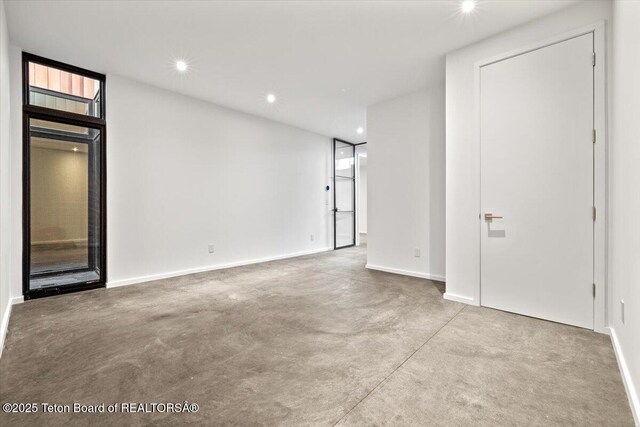 80 Rancher St, Jackson, WY 83001 - unfurnished room featuring baseboards, recessed lighting, and concrete floors