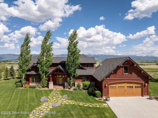 2321 S 3500 W, Driggs, ID 83422 - view of front of property with concrete driveway, board and batten siding, a front lawn, and a mountain view