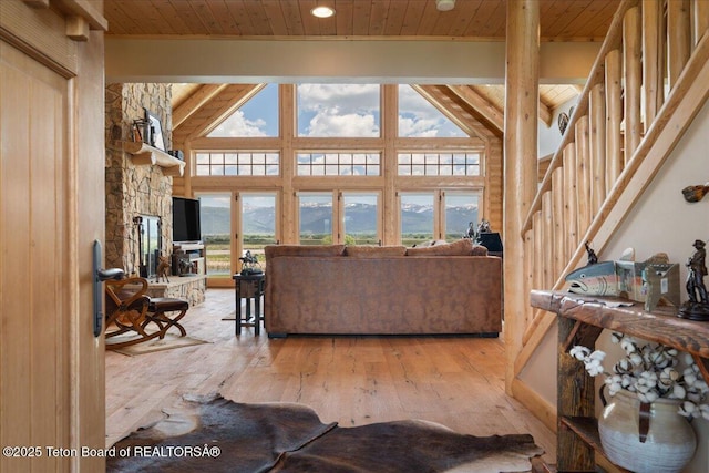 2321 S 3500 W, Driggs, ID 83422 - living area featuring a wooden ceiling with exposed beams, wood-type flooring, high vaulted ceiling, stairway, and recessed lighting