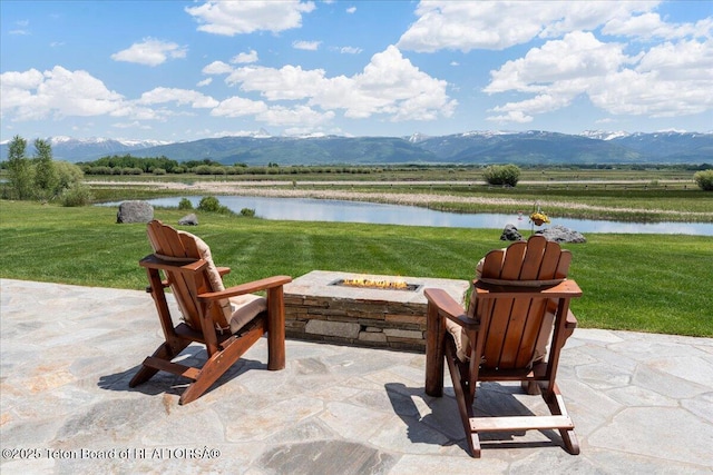 2321 S 3500 W, Driggs, ID 83422 - view of patio / terrace featuring a fire pit and a water and mountain view