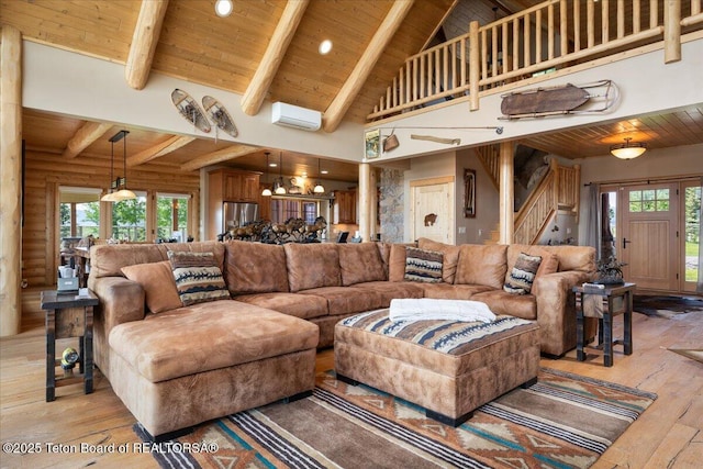 2321 S 3500 W, Driggs, ID 83422 - living room featuring a wood ceiling with exposed beams, light wood-style flooring, stairway, high vaulted ceiling, and a wall unit AC