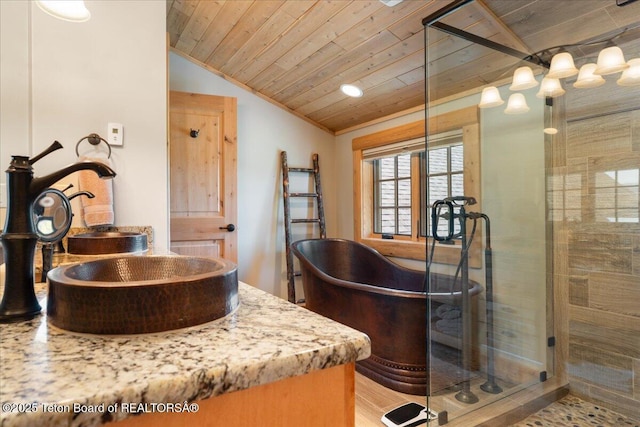 2321 S 3500 W, Driggs, ID 83422 - full bathroom with a freestanding tub, wood ceiling, lofted ceiling, vanity, and a shower