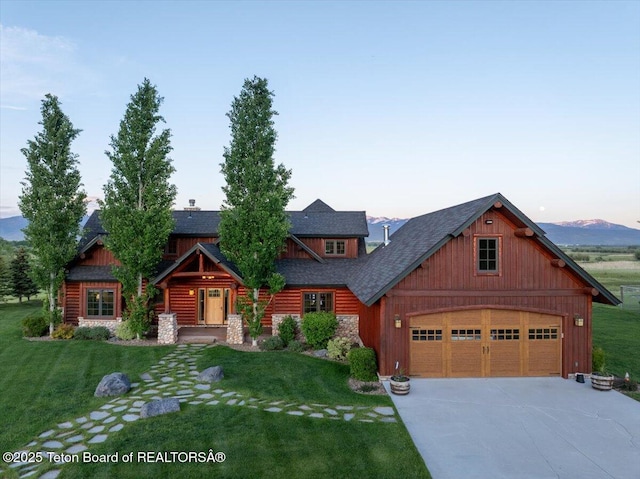 2321 S 3500 W, Driggs, ID 83422 - view of front of house featuring a garage, driveway, and a lawn