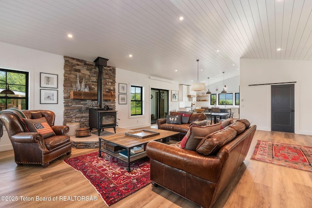 4326 State Line Rd, Freedom, WY 83120 - living area featuring wood ceiling, a wood stove, light wood finished floors, plenty of natural light, and recessed lighting