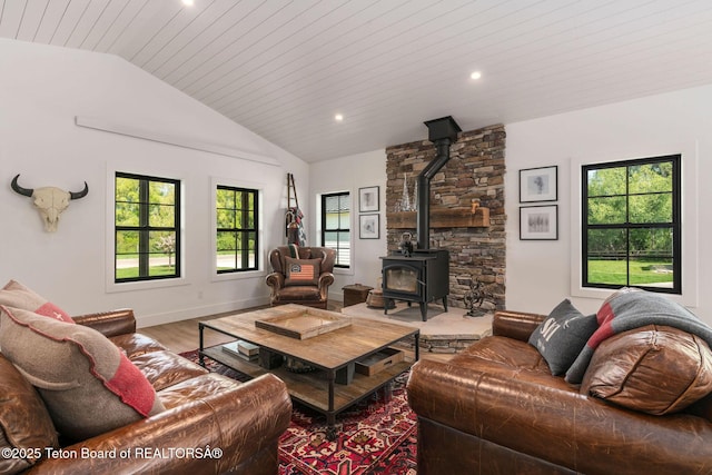 4326 State Line Rd, Freedom, WY 83120 - living room with vaulted ceiling, a wood stove, wood finished floors, recessed lighting, and wood ceiling