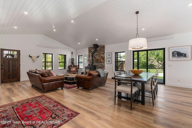 4326 State Line Rd, Freedom, WY 83120 - living area with a wood stove, vaulted ceiling, light wood-type flooring, wood ceiling, and recessed lighting