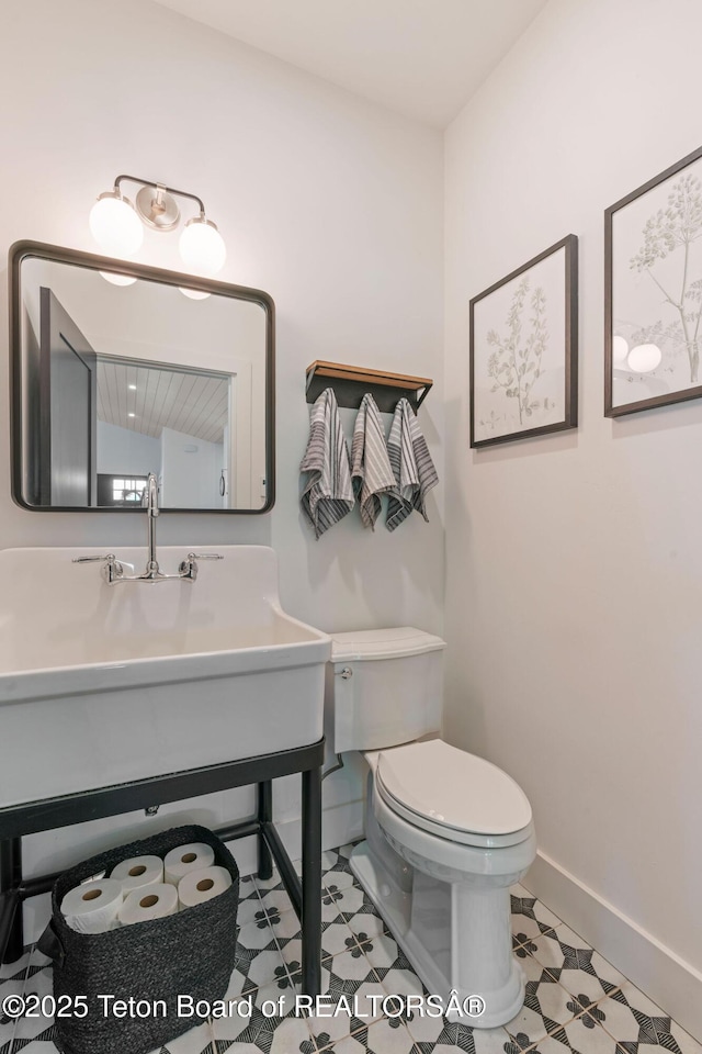 4326 State Line Rd, Freedom, WY 83120 - half bath with toilet and tile patterned flooring