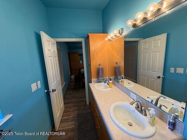 89 W W St, Star Valley Ranch, WY 83127 - bathroom with double vanity, wood finished floors, and baseboards