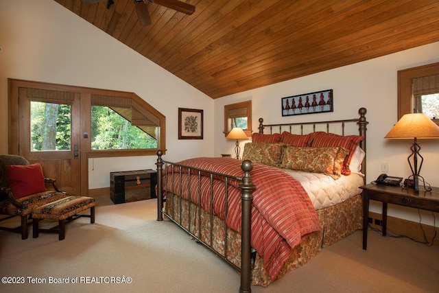 bedroom featuring lofted ceiling, carpet flooring, and wooden ceiling