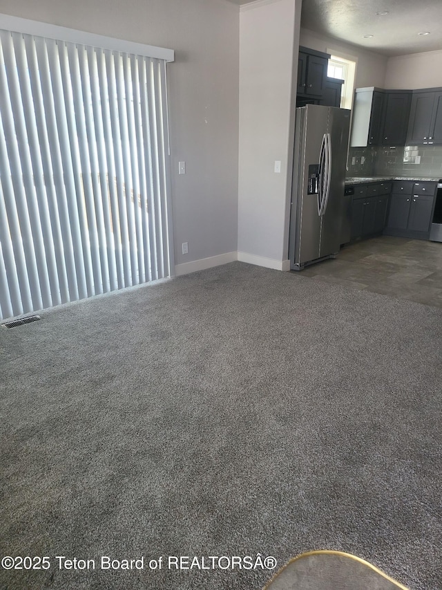 360 Wooden Spur Dr, Alpine, WY 83128 - unfurnished living room with light carpet